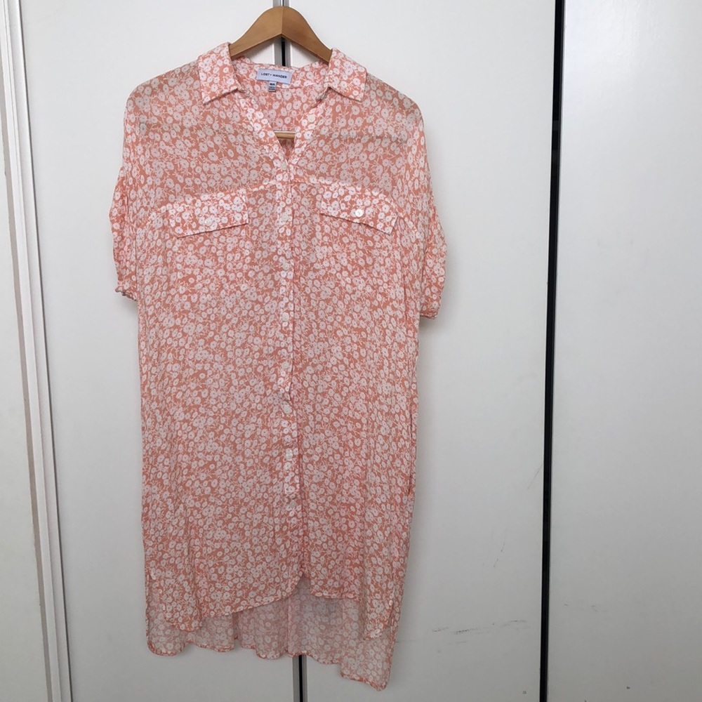 Peach sheath dress with flower print.